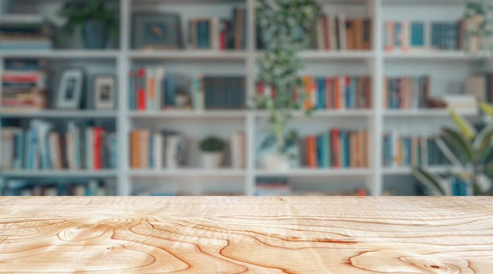 Empty,Wood,Table,Top,With,Blur,Background,Of,Library,At